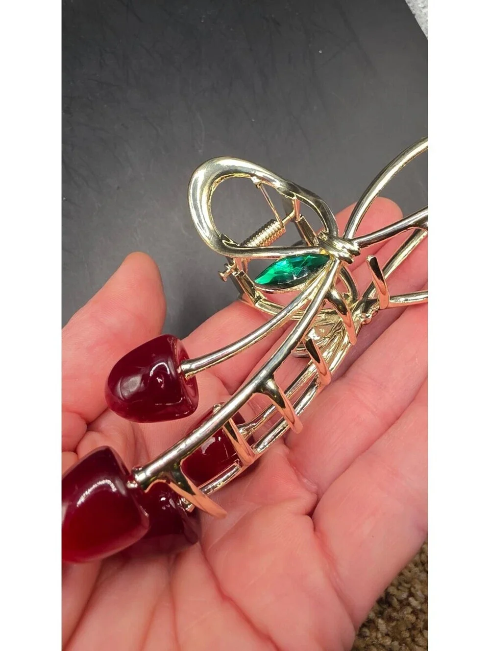 Elegant Gold-Tone Cherry Bow Hair Clip with Red Accents and Green Leaf Detail –